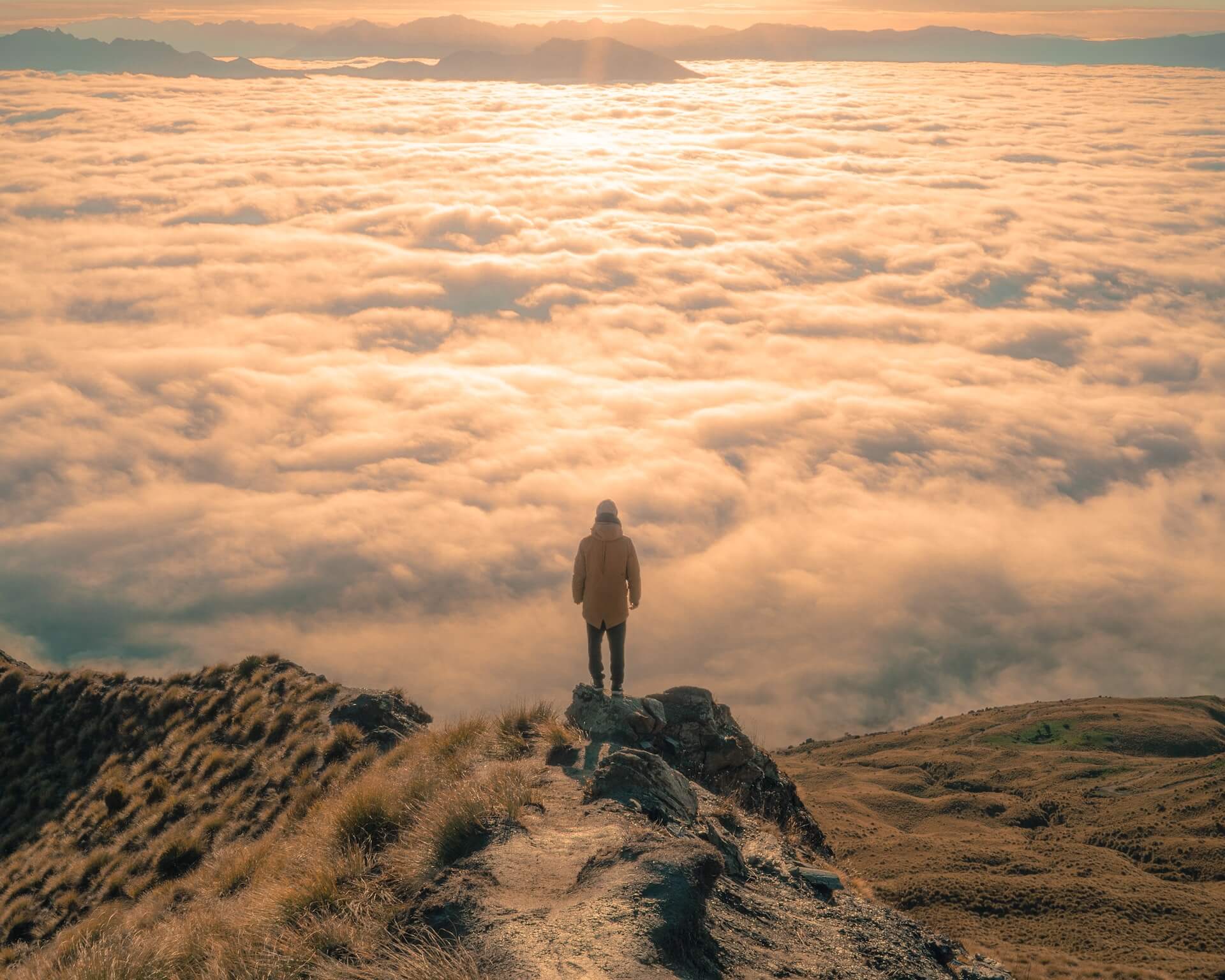 image of person looking out over expanse of cloud to represent the search for activity indicating intent.